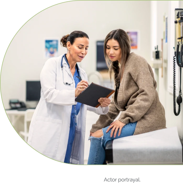 Rare kidney disease patient talking with her doctor